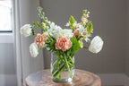 6 Clear Hurricane Vase on table